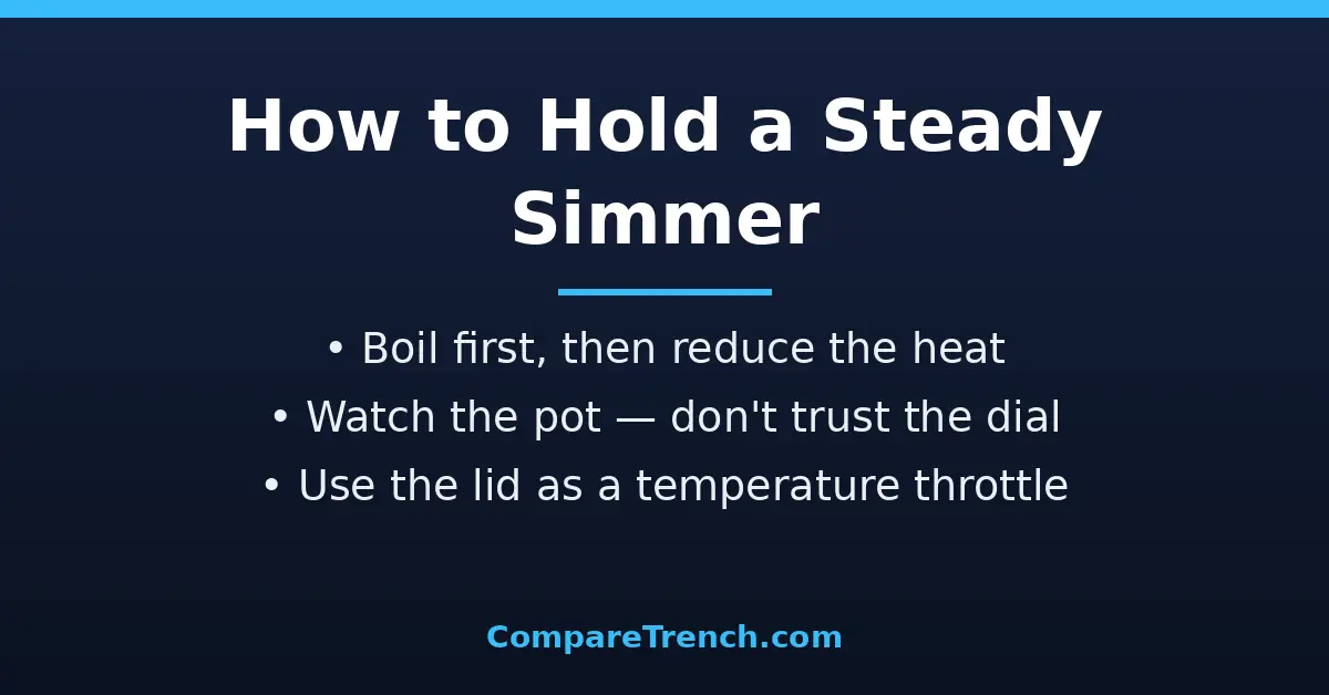 Hand adjusting a stove knob to maintain a gentle simmer, a key skill in the difference between simmer and boil